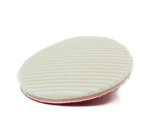 Round white microfiber wool car polishing pad with textured surface on white background