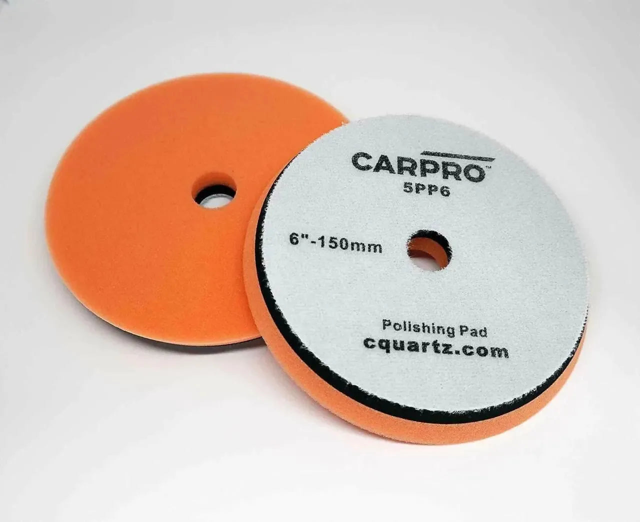 CarPro 6-inch orange foam polishing pads with label and hole in center on white background