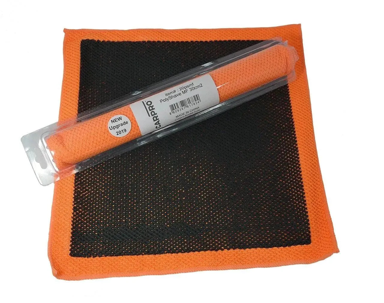 CarPro PolyShave orange microfiber decontamination towel with black textured surface in packaging