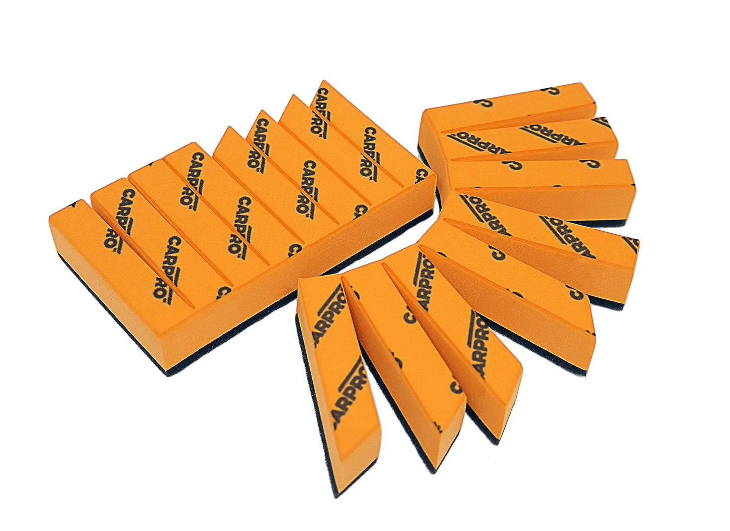 Set of orange CARPRO foam block applicators with black logo, used for car detailing and coating