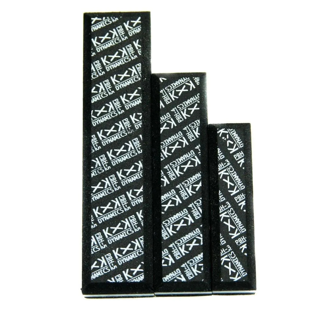 Set of three black adhesive foam blocks with white KXK Dynamics logo pattern on white background