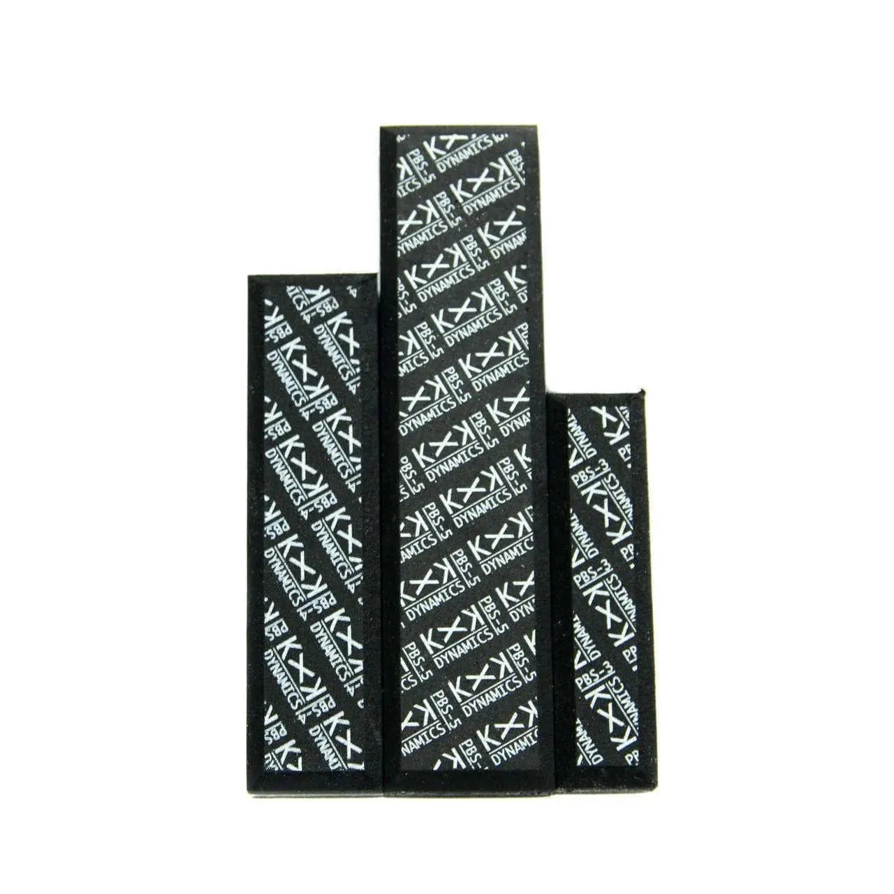 Three black rectangular blocks with white KXK Dynamics logo and text on them