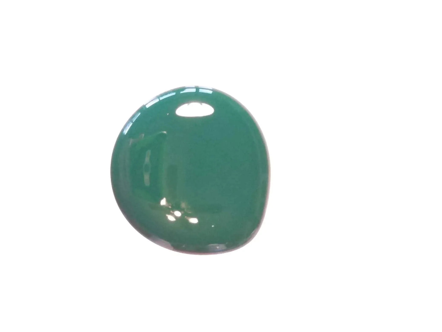 Glossy green paint droplet on white background with reflections