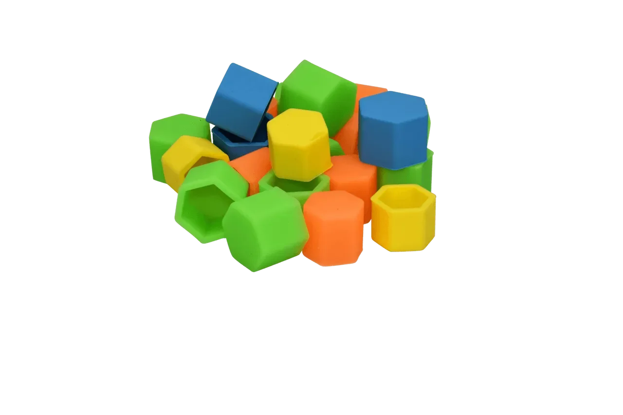 Colorful hexagonal silicone caps in green, yellow, blue, and orange piled together