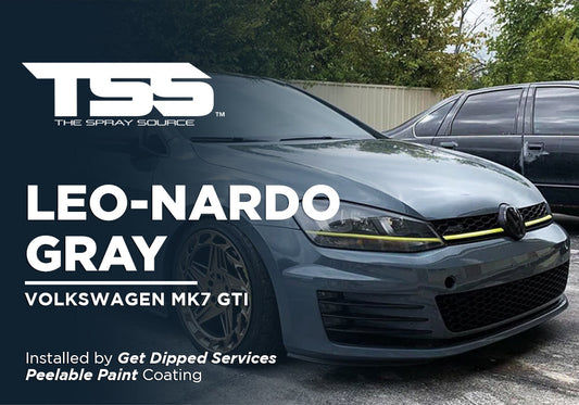 Gray Volkswagen MK7 GTI with custom yellow accents and bronze wheels in outdoor parking lot