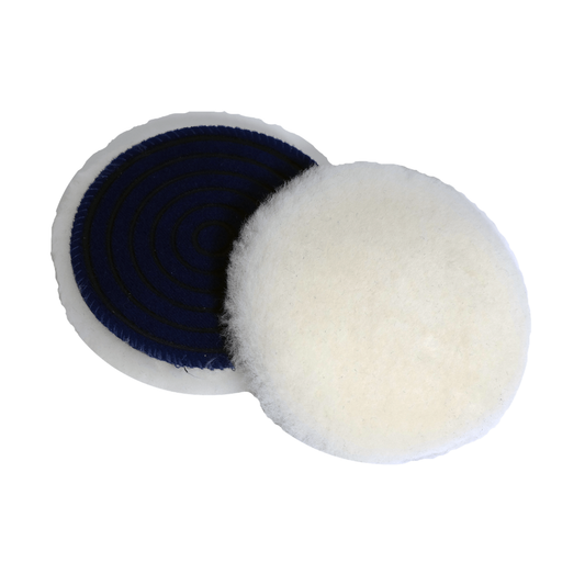 Two round CarPro Merino wool polishing pads, one showing soft white wool front and one the black textured back