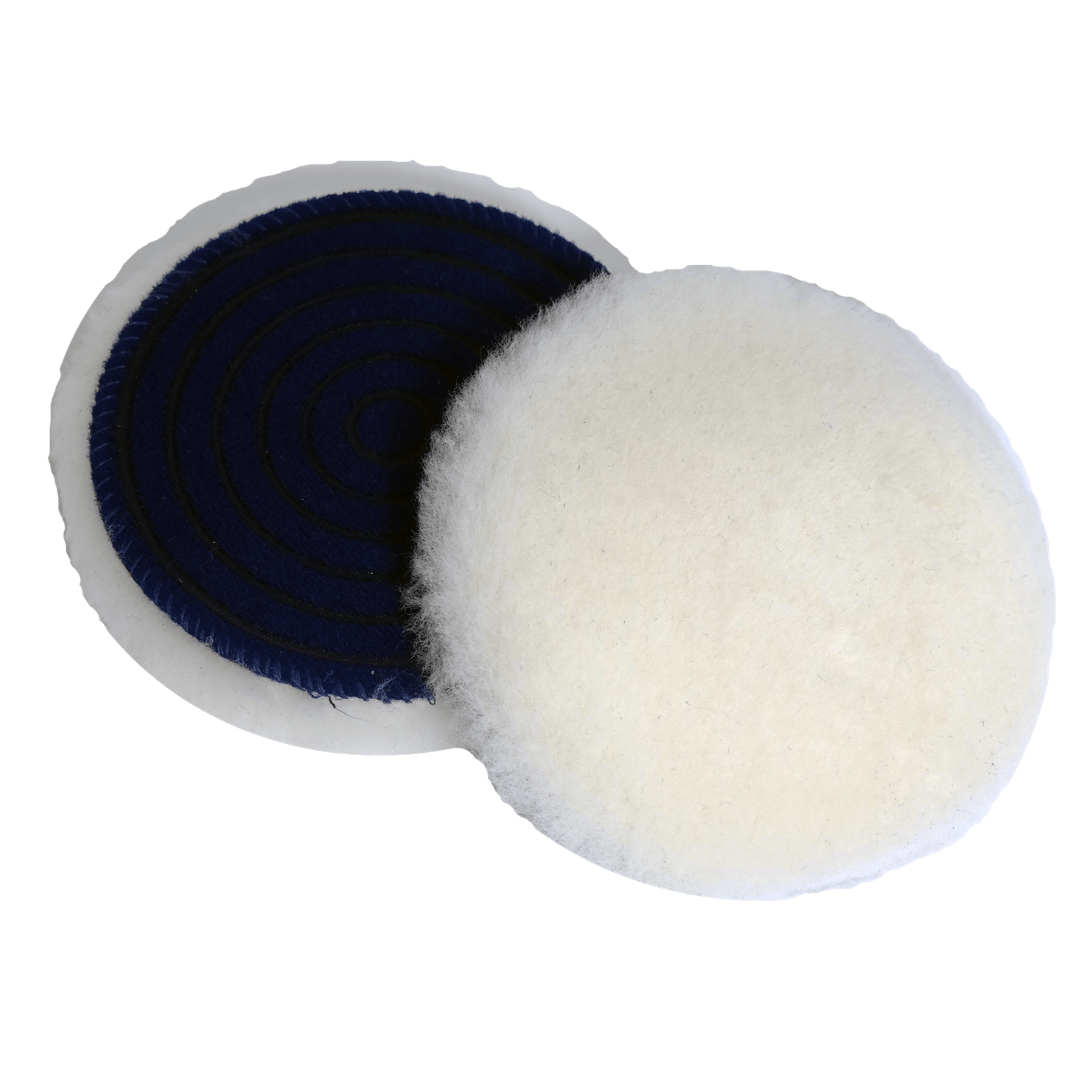 Two round CarPro Merino wool polishing pads, one showing soft white wool front and one the black textured back