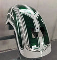 custom painted motorcycle fender with green metallic basecoat and white pinstripe design in a workshop