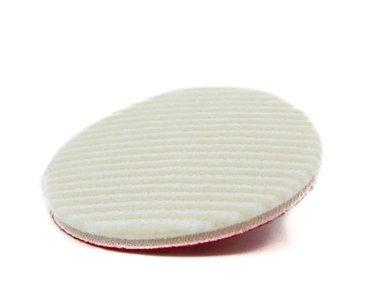 Round white microfiber wool car polishing pad with textured surface on white background