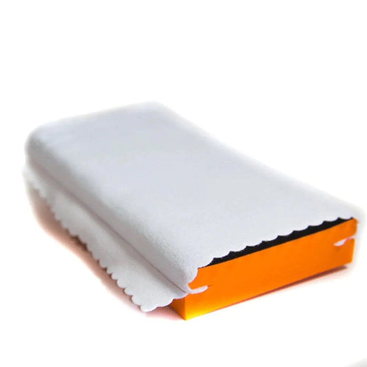 Orange rectangular detail applicator wrapped in a protective white microfiber cloth