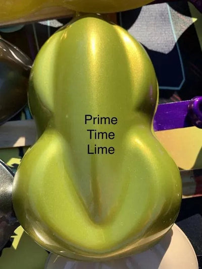 Shiny lime green paint sample labeled Prime Time Lime with a smooth, curved surface