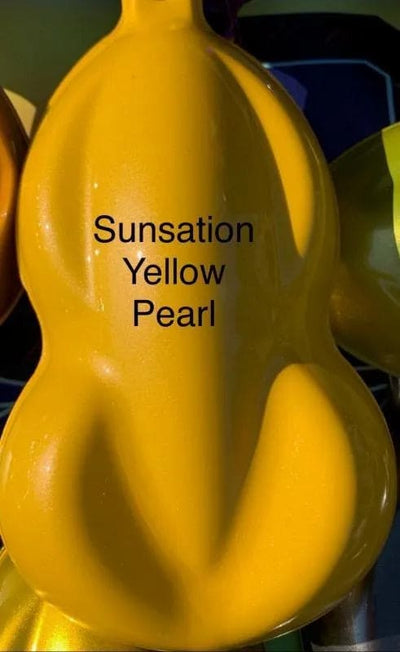 Sunsation Yellow Pearl glossy paint sample on curved test panel showing metallic finish